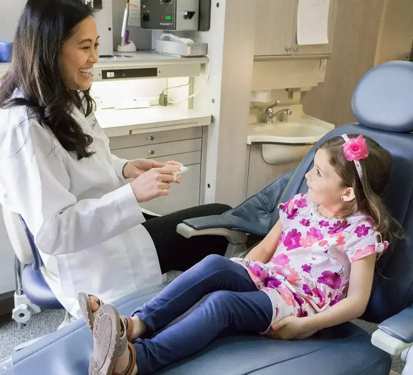 Dr. Patricia Chao with a young patient
